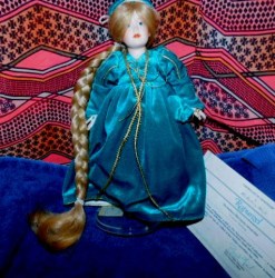 11" DANBURY MINT 1980S BLONDE RAPUNZEL BISQUE FACE DOLL, STAND, CERTIFICATE